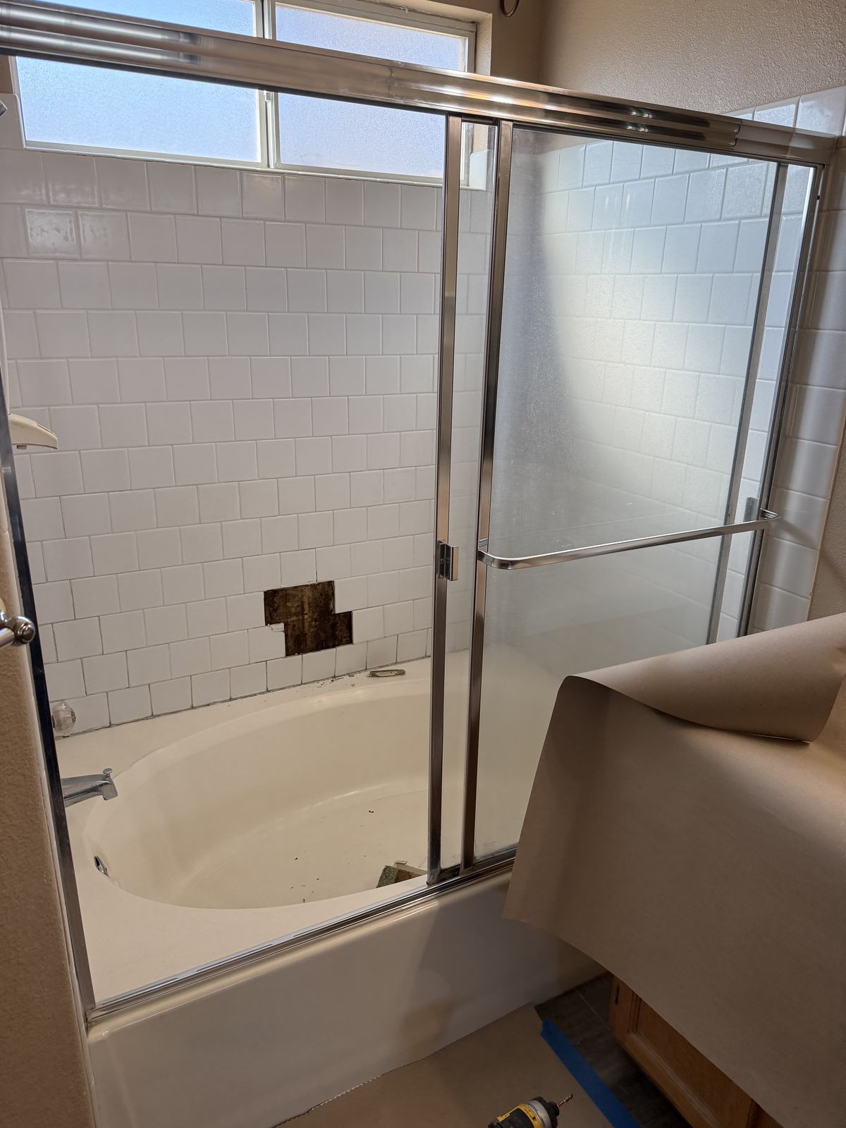 Original tub and dated tile before remodel